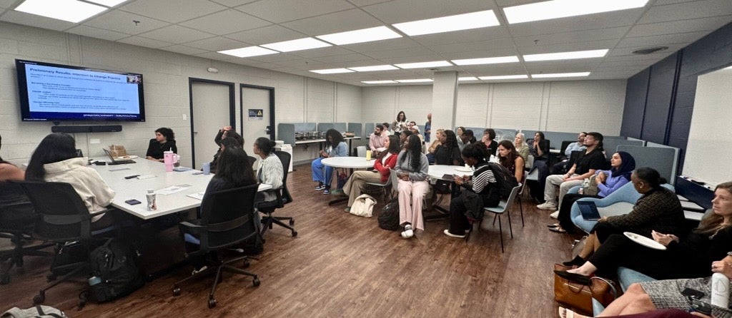 A group photo of the 2025 Building Bridges Conference in the Center for Health Equity office.